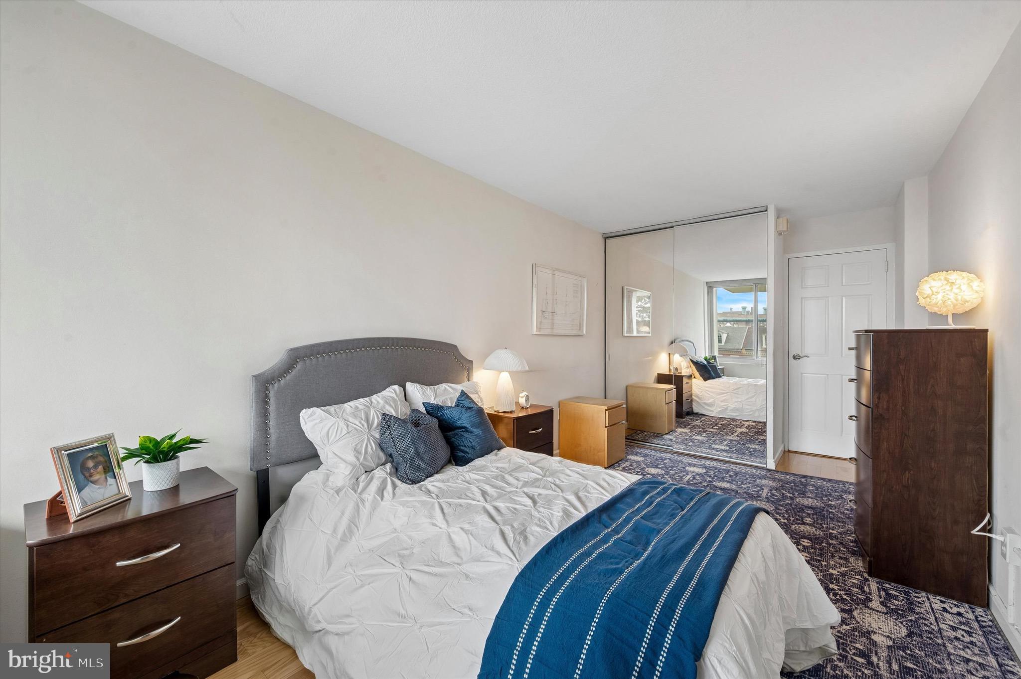 604 South Washington Square, Unit 309 Philadelphia, PA 19106 - Photo 12 of 28 a spacious bedroom with a bed and cabinet