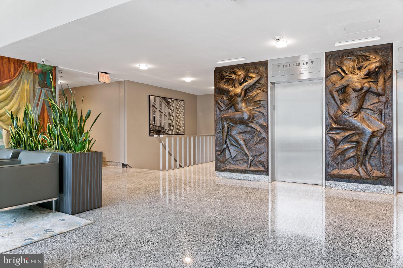 604 South Washington Square, Unit 309 Philadelphia, PA 19106 - Photo 19 of 28 a view of a hallway with paintings on the wall
