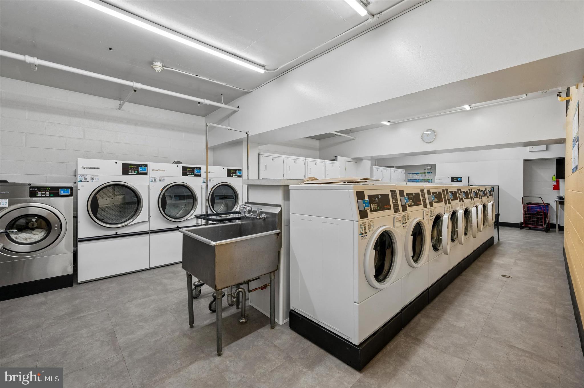 604 South Washington Square, Unit 309 Philadelphia, PA 19106 - Photo 22 of 28 a utility room with dryer and washer