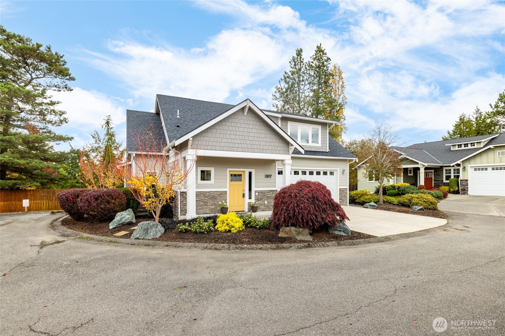 1107 Harmony Lane Mount Vernon, WA 98274 - Photo 1 of 27 a front view of a house with a garden and trees