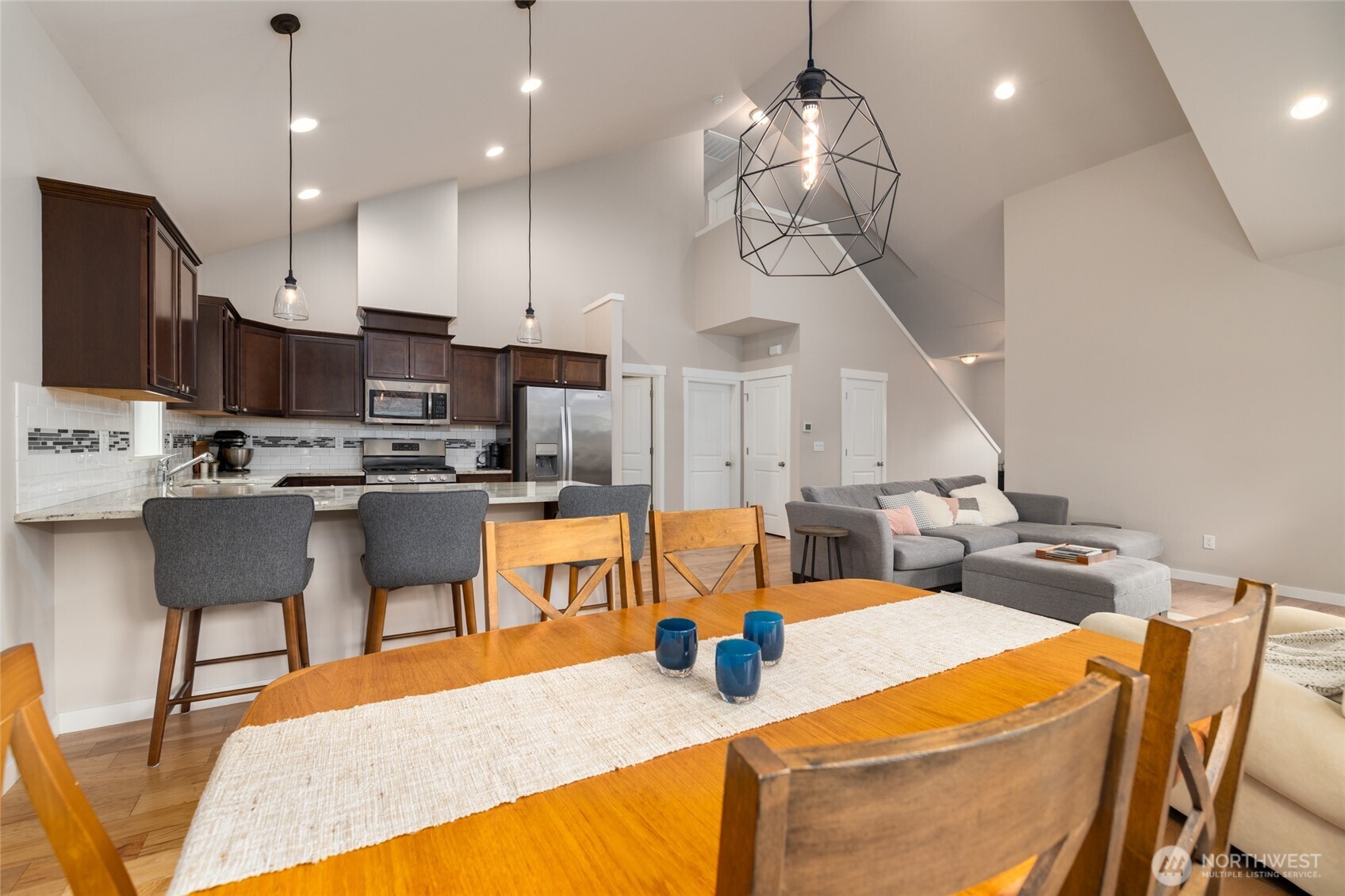 1107 Harmony Lane Mount Vernon, WA 98274 - Photo 12 of 27 a kitchen with stainless steel appliances kitchen island granite countertop a sink a stove and chairs