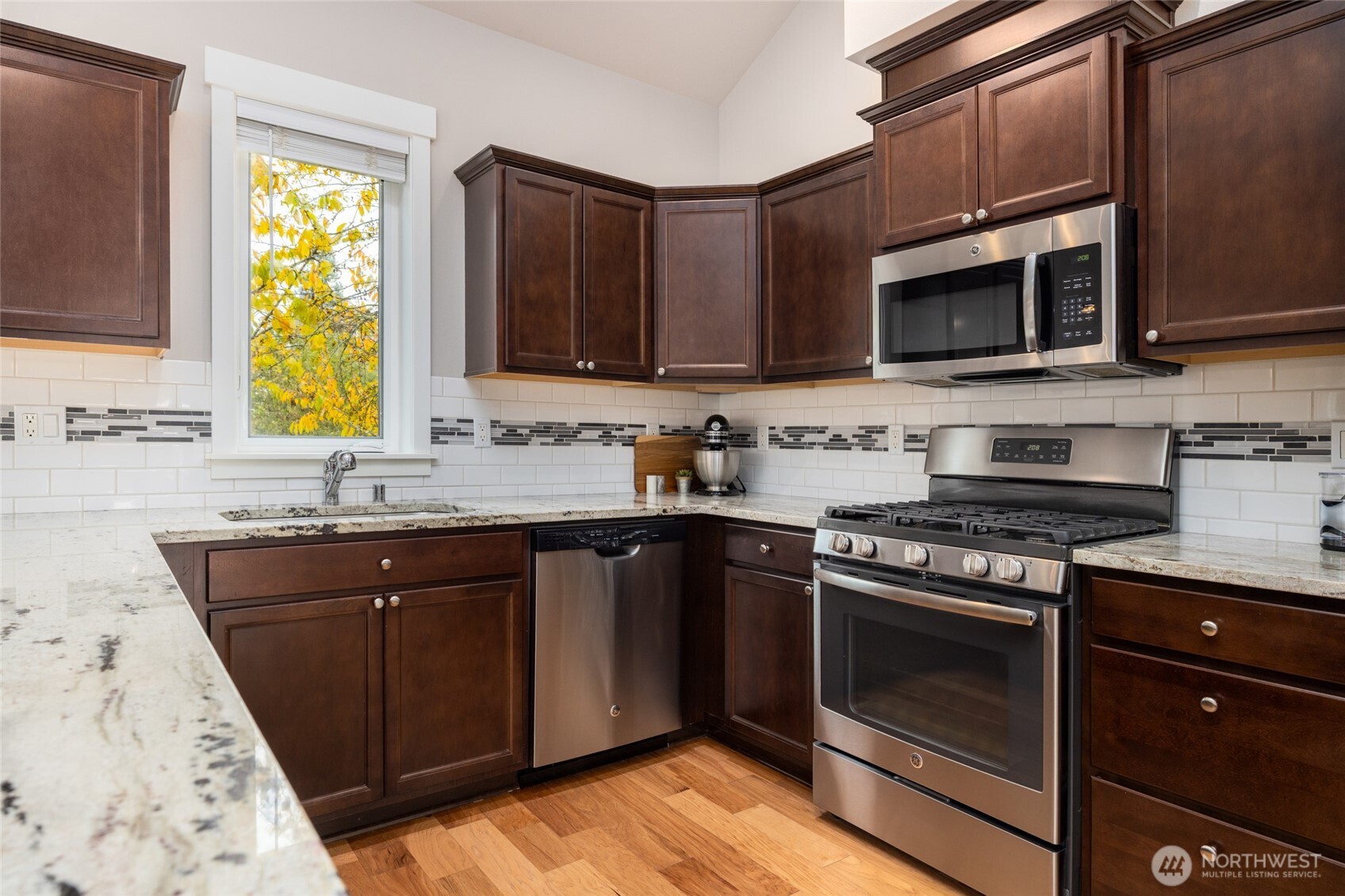 1107 Harmony Lane Mount Vernon, WA 98274 - Photo 15 of 27 a kitchen with stainless steel appliances granite countertop a stove microwave and sink