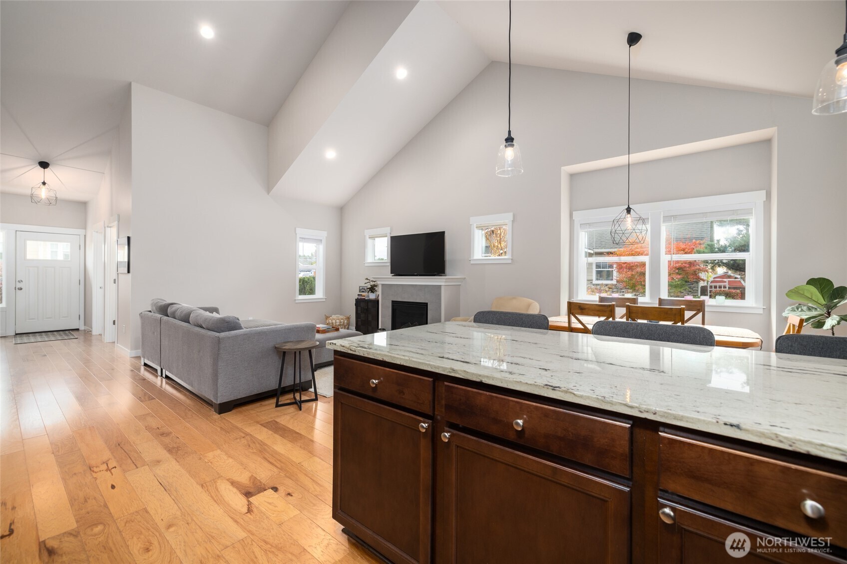 1107 Harmony Lane Mount Vernon, WA 98274 - Photo 17 of 27 a living room with stainless steel appliances granite countertop couches a flat screen tv and kitchen island
