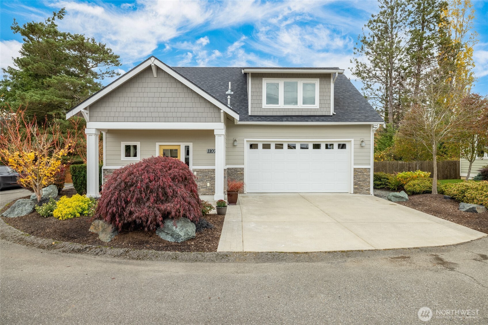1107 Harmony Lane Mount Vernon, WA 98274 - Photo 2 of 27 a front view of house with yard and trees in the background