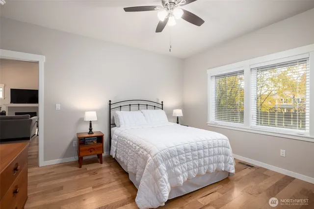 a bedroom with a bed and a tv