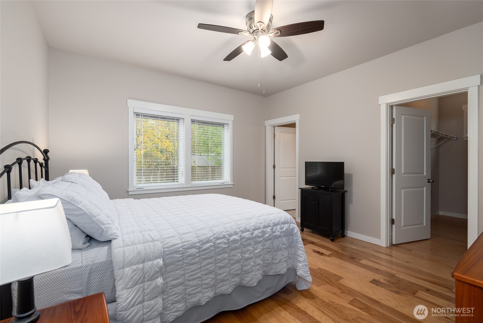 1107 Harmony Lane Mount Vernon, WA 98274 - Photo 22 of 27 a bedroom with a bed and a chandelier