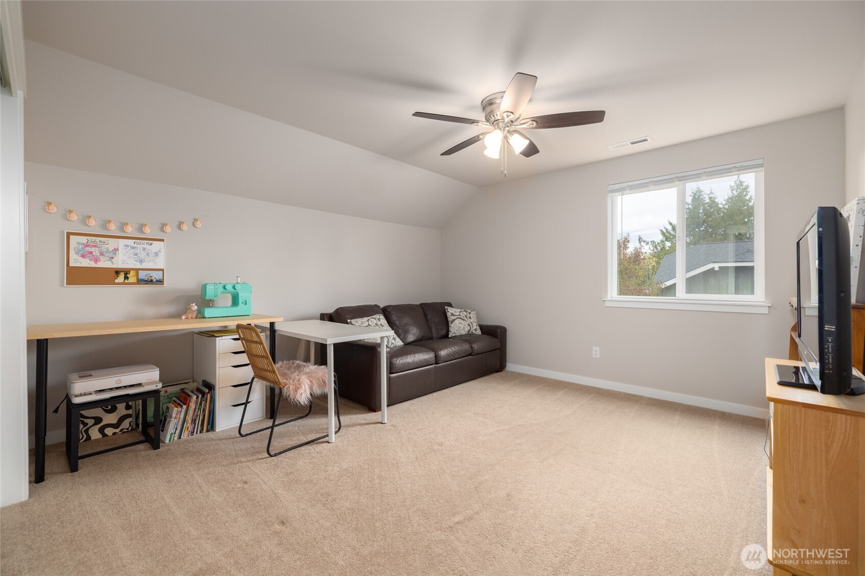 1107 Harmony Lane Mount Vernon, WA 98274 - Photo 27 of 27 a living room with furniture and a flat screen tv