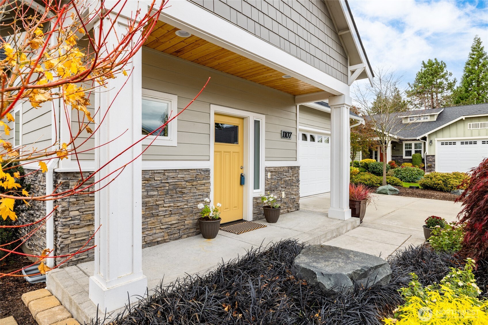 1107 Harmony Lane Mount Vernon, WA 98274 - Photo 4 of 27 a front view of a house with a yard and outdoor seating