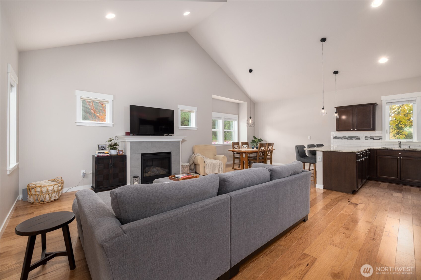 1107 Harmony Lane Mount Vernon, WA 98274 - Photo 6 of 27 a living room with furniture a fireplace and a flat screen tv