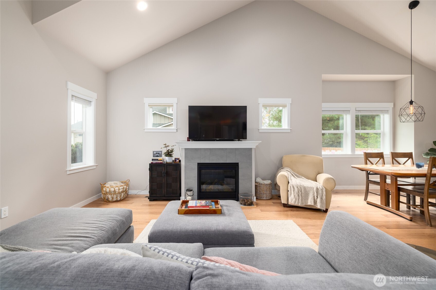 1107 Harmony Lane Mount Vernon, WA 98274 - Photo 7 of 27 a living room with furniture a fireplace and a flat screen tv