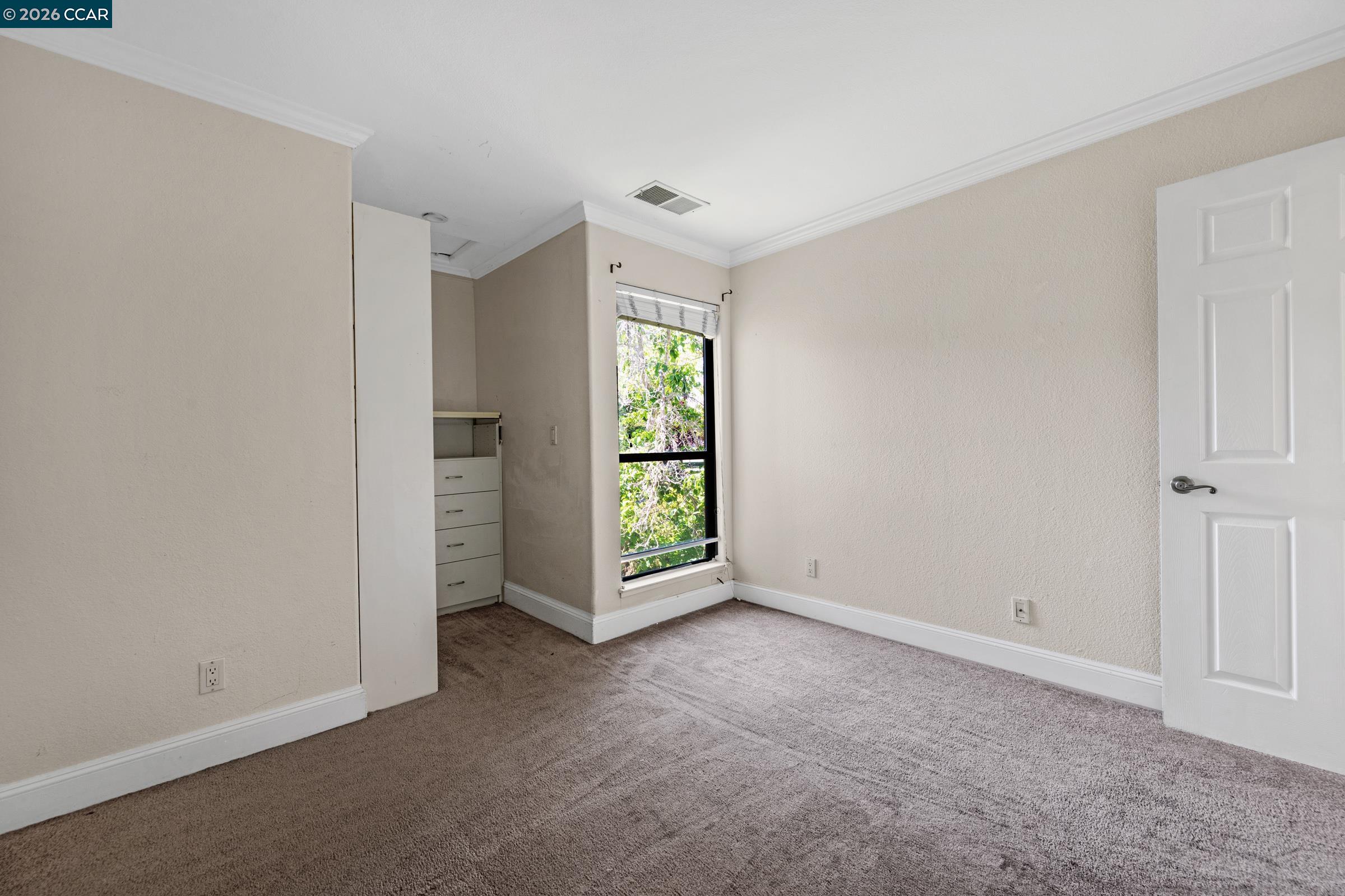 1544 Bailey Road, Unit 30 Concord, CA 94521 - Photo 18 of 33 an empty room with windows and closet