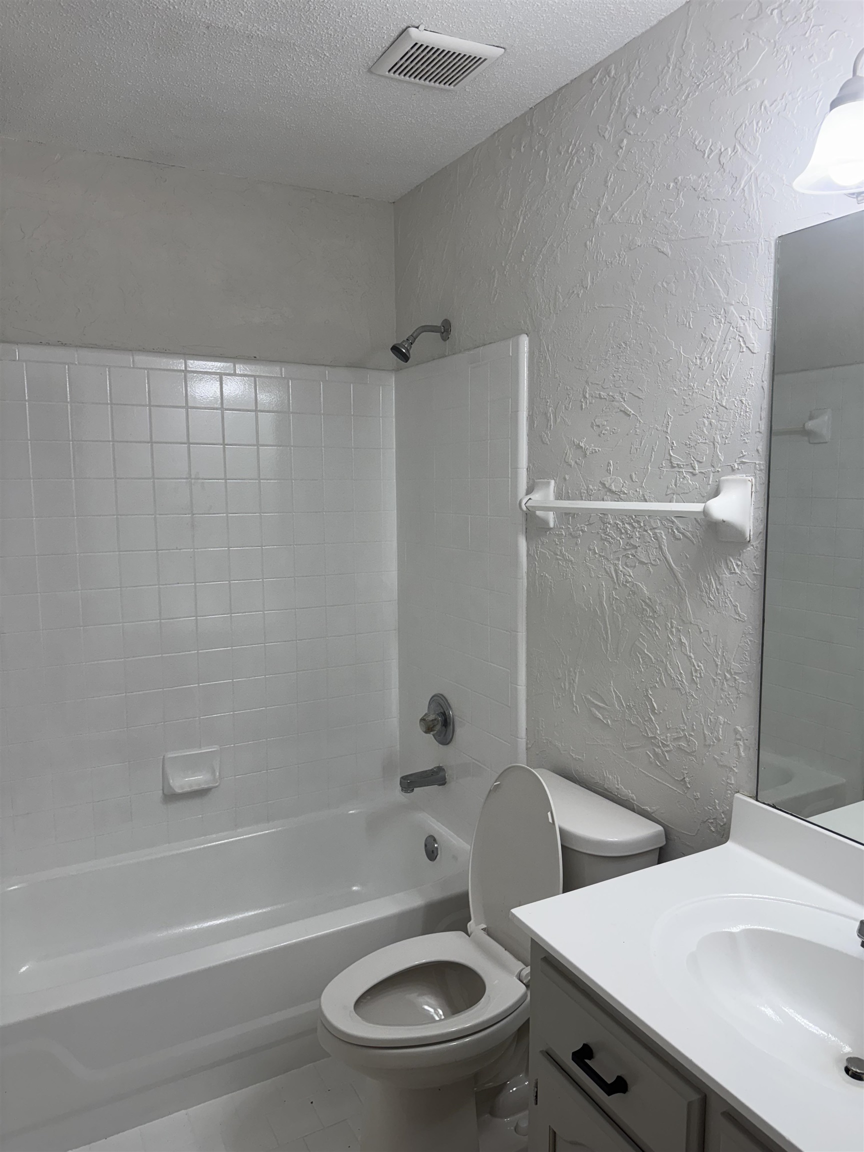 6893 Snyder Road Memphis, TN 38141 - Photo 7 of 13 a bathroom with a sink a toilet and a bathtub