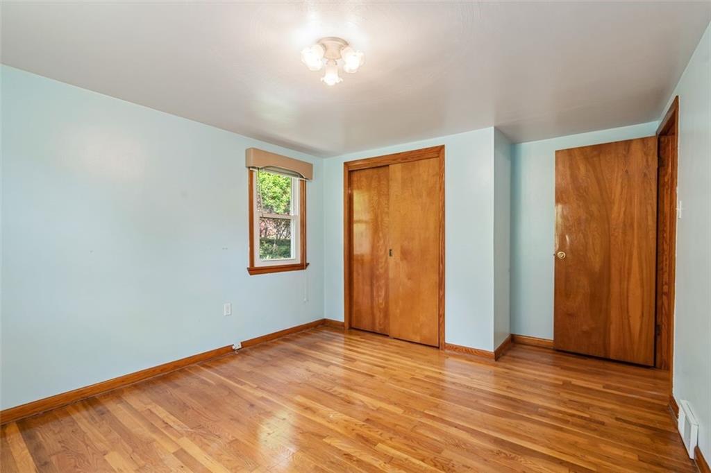 223 Washington Avenue Homestead, PA 15120 - Photo 15 of 31 a view of empty room with wooden floor and fan