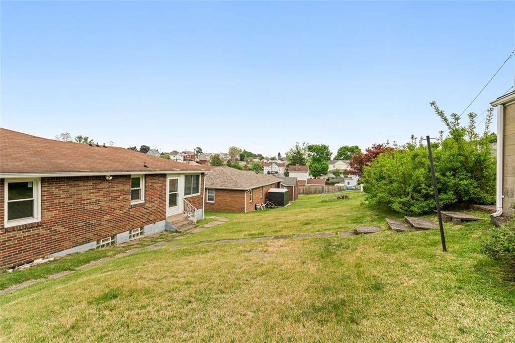 223 Washington Avenue Homestead, PA 15120 - Photo 25 of 31 a view of a house with a yard