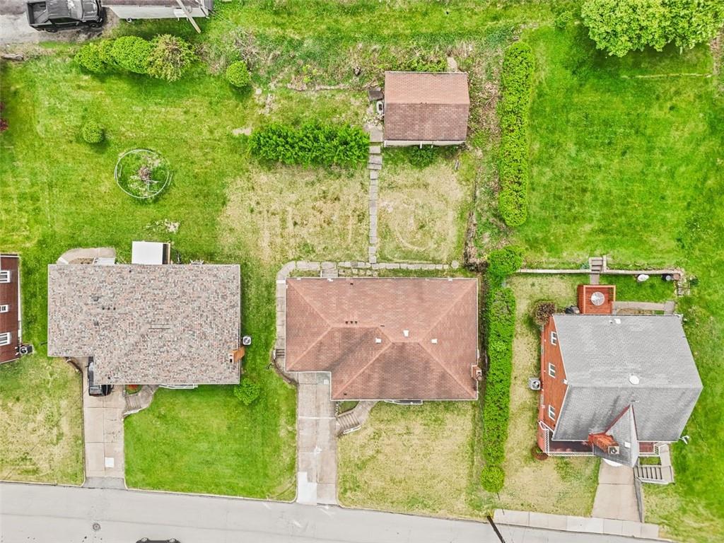 223 Washington Avenue Homestead, PA 15120 - Photo 3 of 31 an aerial view of a house with a garden and a yard