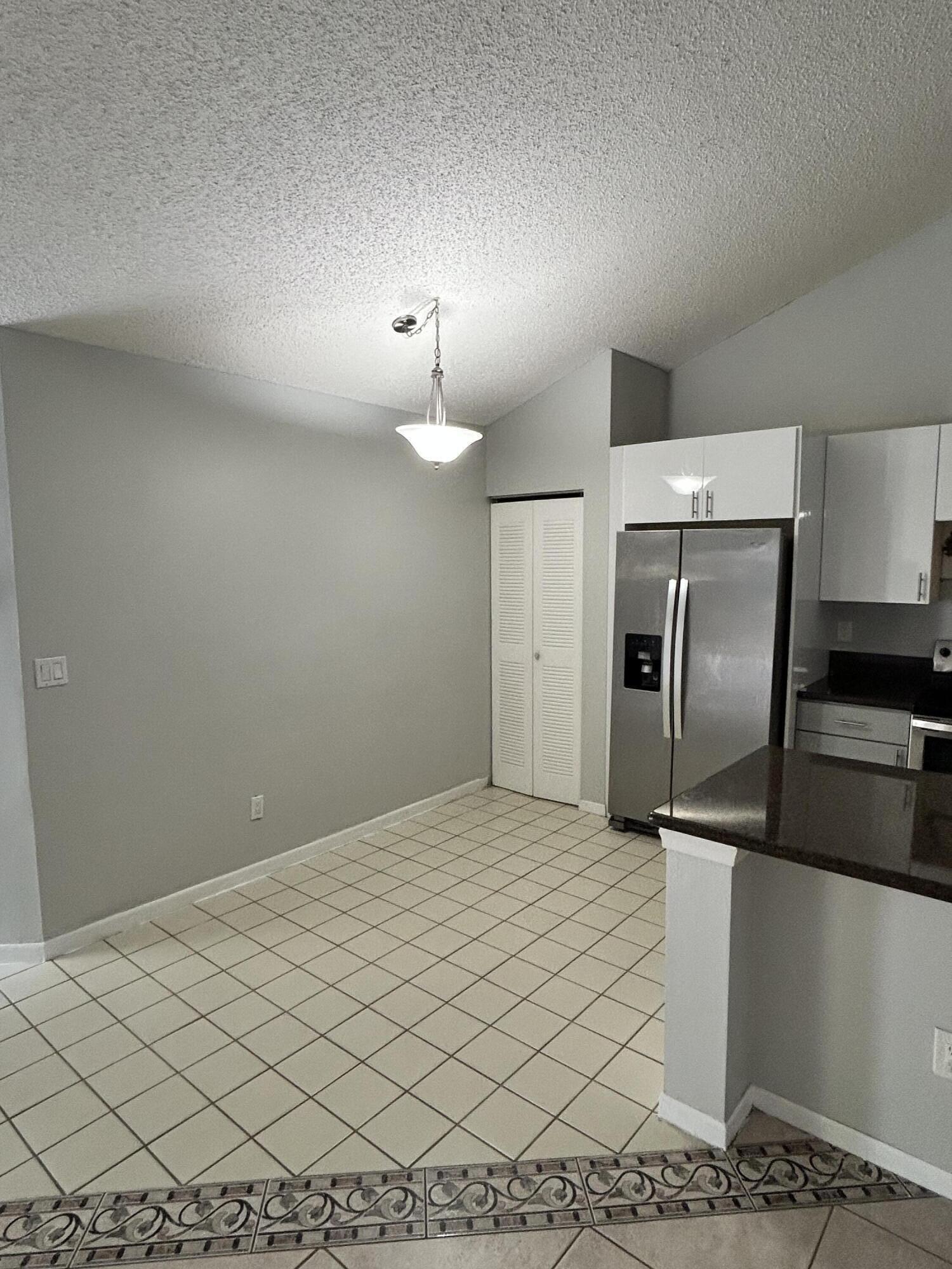1158 Summit Trail Circle, Unit D West Palm Beach, FL 33415 - Photo 3 of 10 a view of a kitchen with a sink
