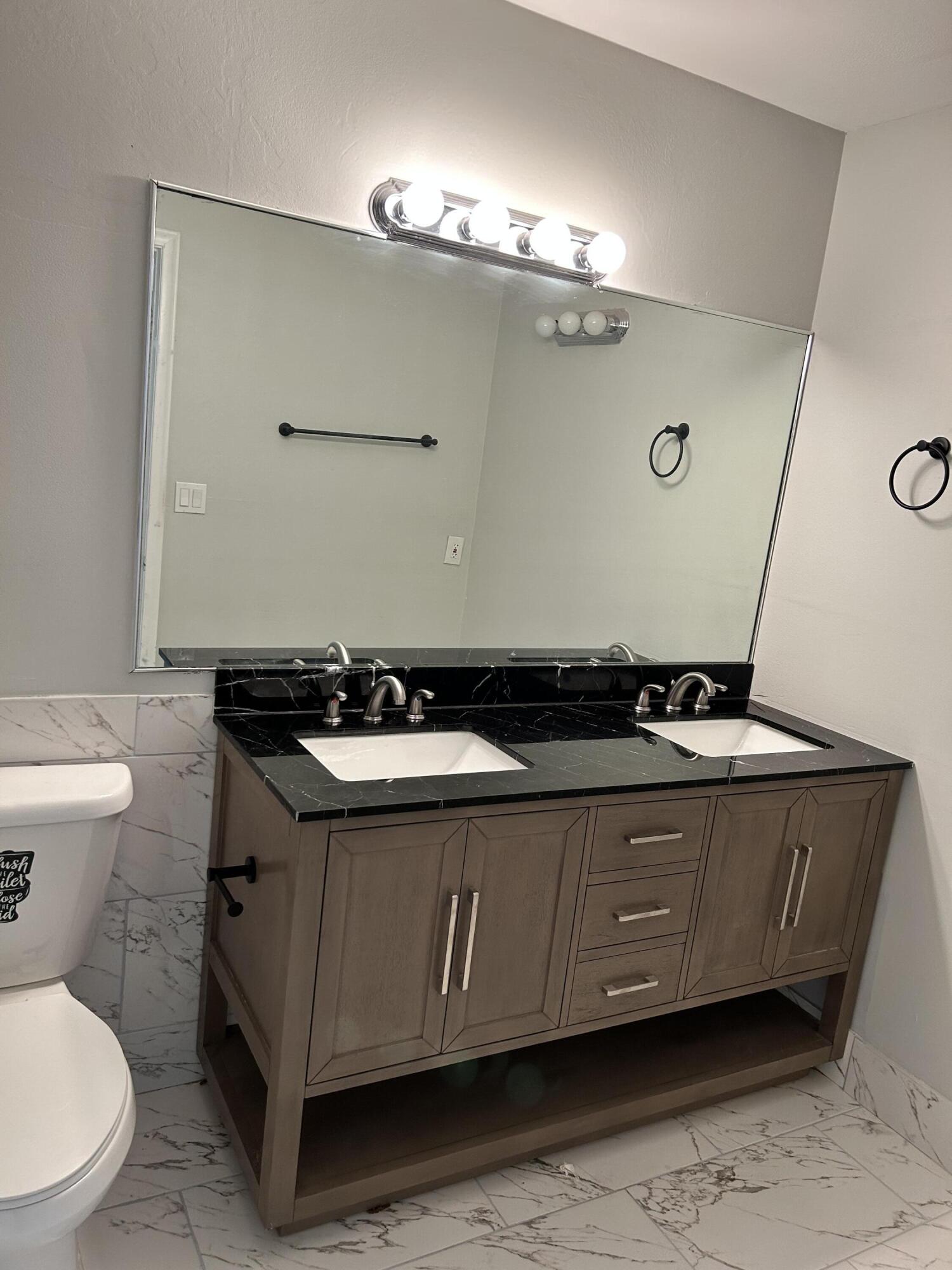 1158 Summit Trail Circle, Unit D West Palm Beach, FL 33415 - Photo 5 of 10 a bathroom with a sink and a toilet