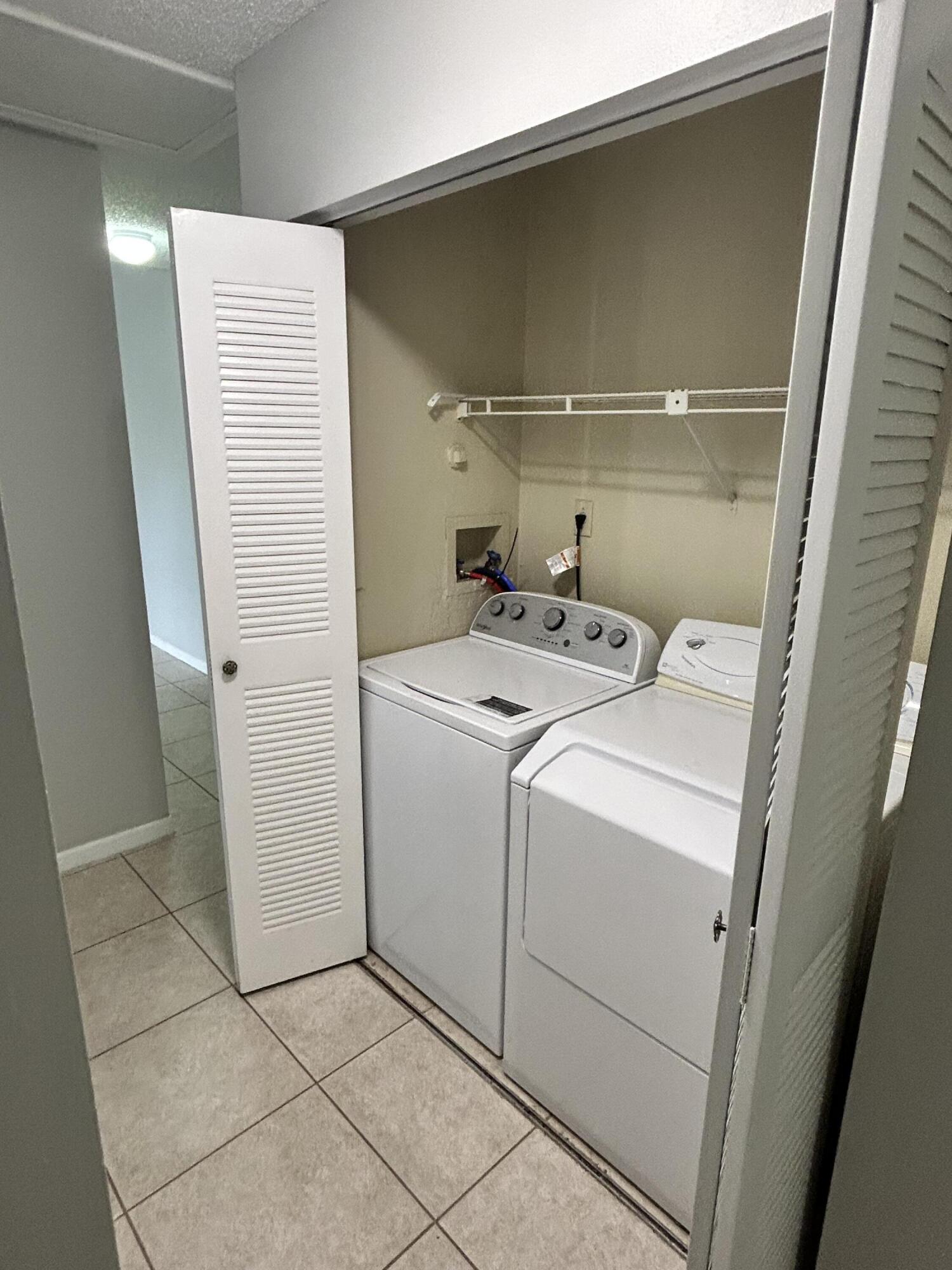 1158 Summit Trail Circle, Unit D West Palm Beach, FL 33415 - Photo 10 of 10 a utility room with dryer and washer