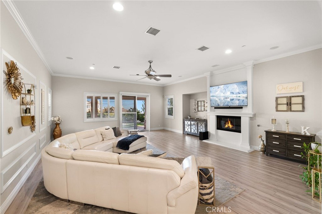4947 Palomino Place Rancho Cucamonga, CA 91737 - Photo 16 of 53 a living room with furniture and a fireplace