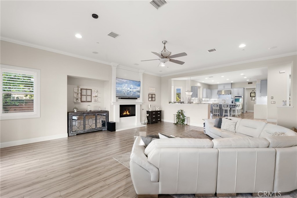 4947 Palomino Place Rancho Cucamonga, CA 91737 - Photo 17 of 53 a living room with furniture or fireplace and a wooden floor