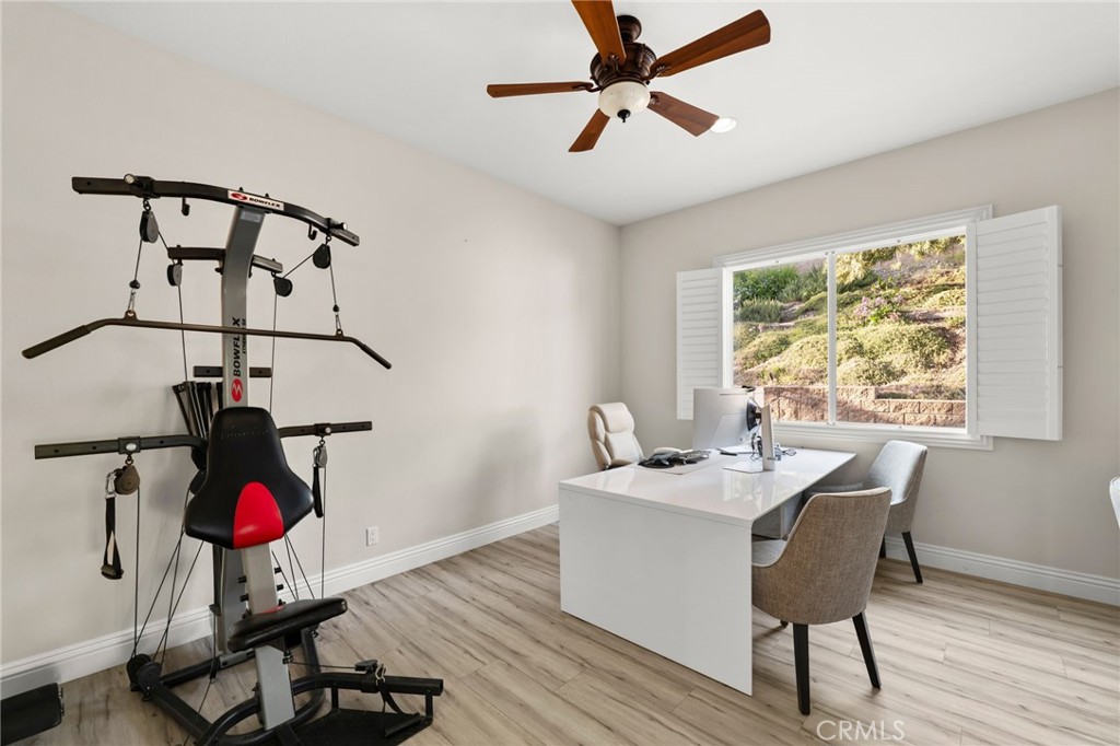 4947 Palomino Place Rancho Cucamonga, CA 91737 - Photo 22 of 53 a view of a workspace with furniture and a window