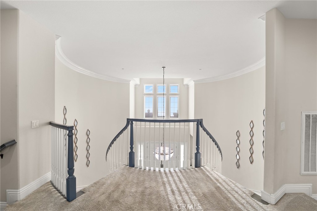 4947 Palomino Place Rancho Cucamonga, CA 91737 - Photo 24 of 53 a view of staircase with white walls and a window