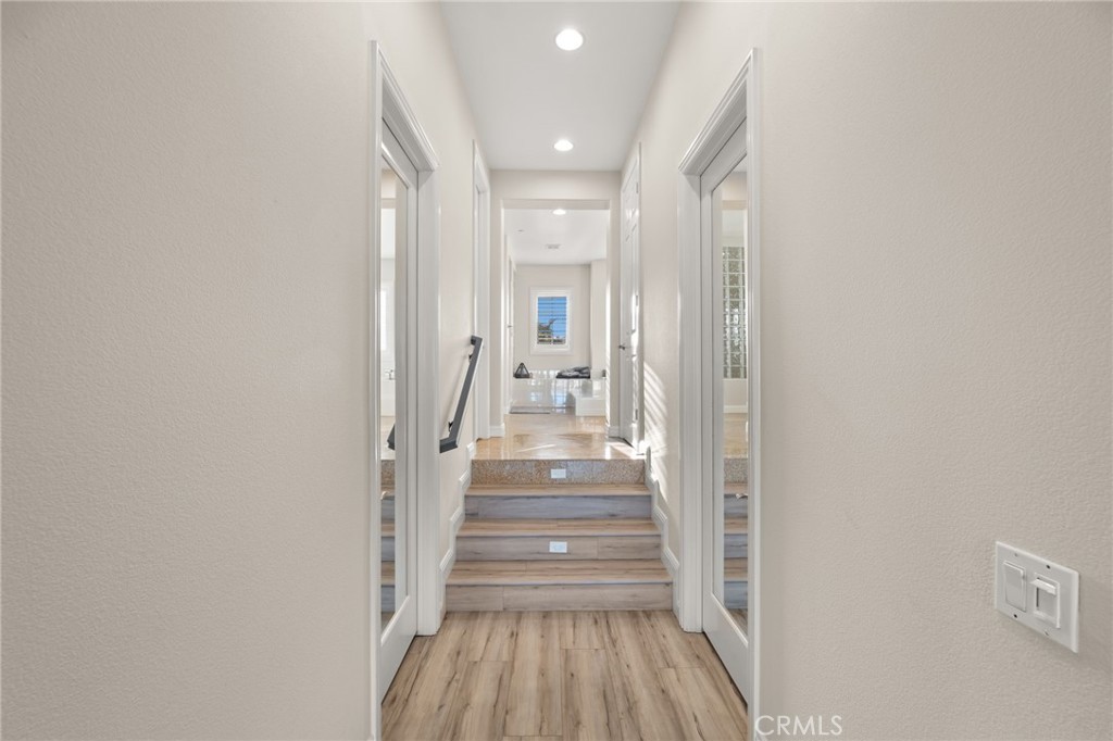 4947 Palomino Place Rancho Cucamonga, CA 91737 - Photo 27 of 53 a view of a hallway with wooden floor and staircase