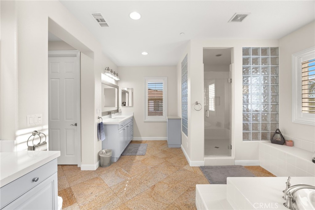4947 Palomino Place Rancho Cucamonga, CA 91737 - Photo 29 of 53 a spacious bathroom with a tub shower and sink