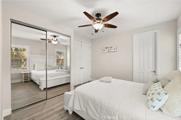 a living room with furniture and a ceiling fan