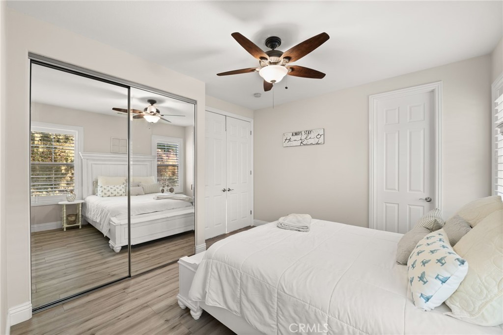 4947 Palomino Place Rancho Cucamonga, CA 91737 - Photo 33 of 53 a bedroom with a large bed and a chandelier