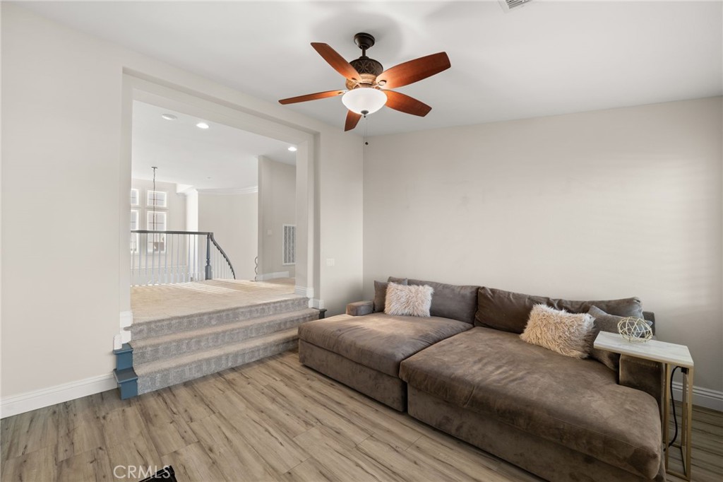 4947 Palomino Place Rancho Cucamonga, CA 91737 - Photo 35 of 53 a living room with furniture and a ceiling fan