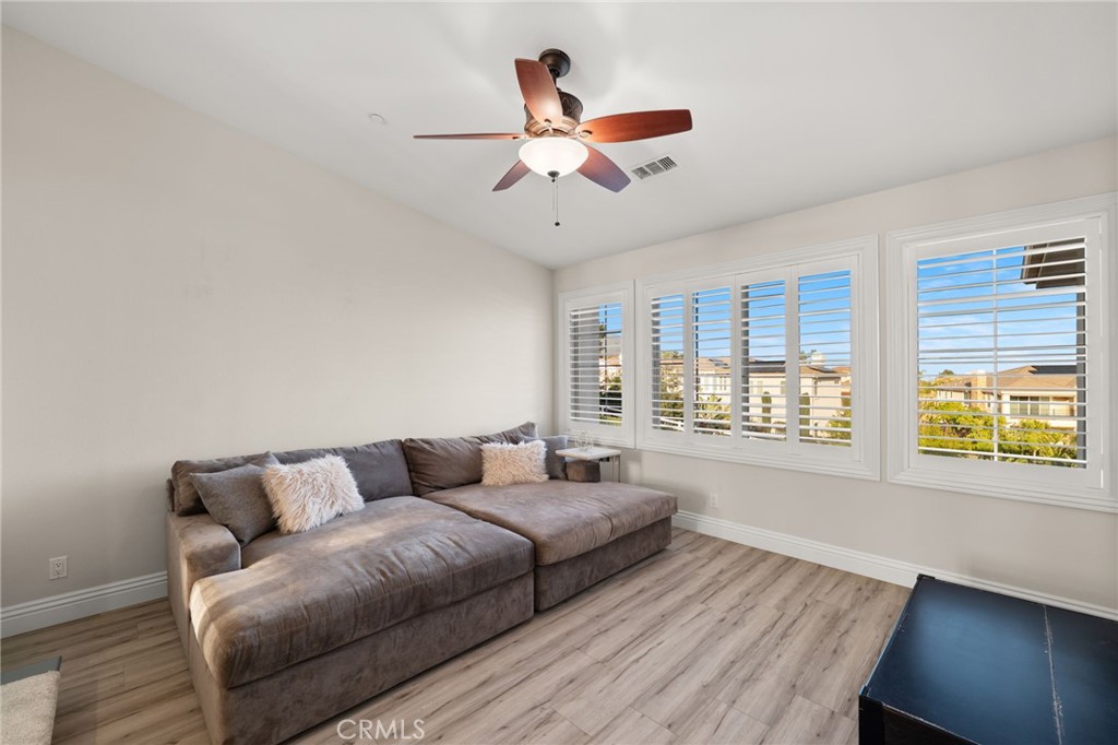 4947 Palomino Place Rancho Cucamonga, CA 91737 - Photo 36 of 53 a living room with furniture and a large window