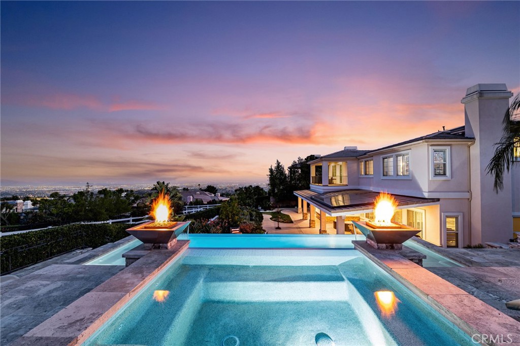 4947 Palomino Place Rancho Cucamonga, CA 91737 - Photo 41 of 53 a view of a swimming pool with a lounge chairs
