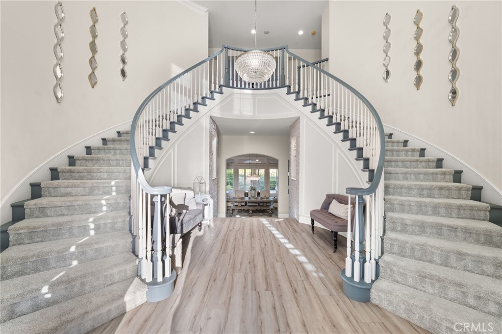 4947 Palomino Place Rancho Cucamonga, CA 91737 - Photo 6 of 53 a view of entryway and hall with wooden floor