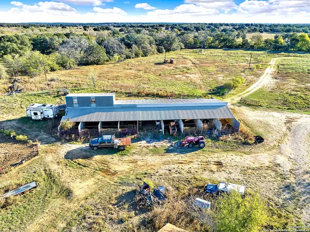 a view of a swimming pool with outdoor seating and yard