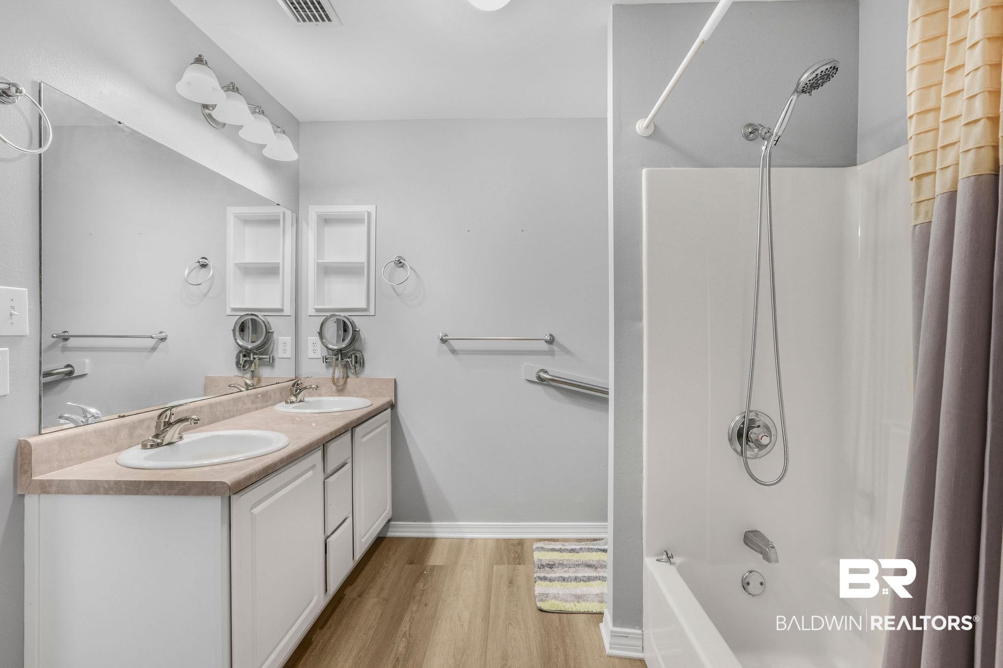 18620 Hammond Street Robertsdale, AL 36567 - Photo 10 of 23 Bathroom with vanity, hardwood / wood-style floors, and shower / bath combo