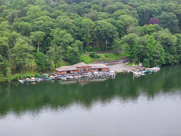 a view of a lake with houses in the back