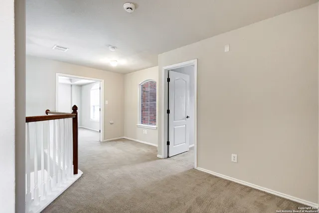 an entryway of a house with wooden floor