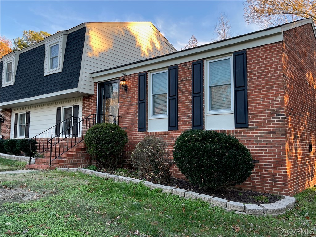 3809 Cresthill Road Chester, VA 23831 - Photo 2 of 44 a view of a house with a yard and plants