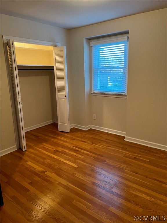 3809 Cresthill Road Chester, VA 23831 - Photo 23 of 44 an empty room with wooden floor and windows