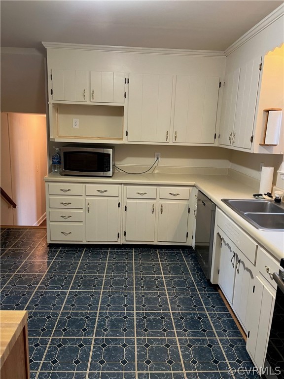 3809 Cresthill Road Chester, VA 23831 - Photo 9 of 44 a kitchen with a stove and white cabinets