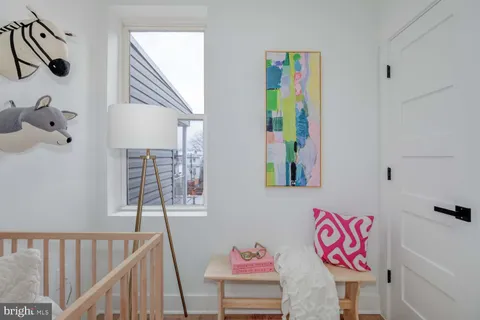a view of an entryway with wooden floor