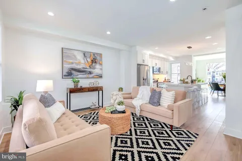 a living room with furniture and a rug