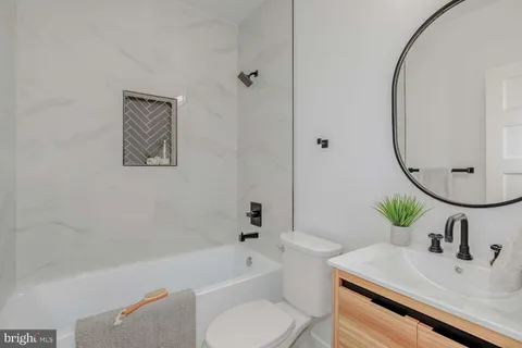 a bathroom with a sink toilet and a bathtub