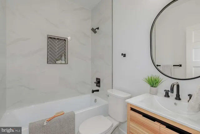 a bathroom with a sink toilet and a bathtub