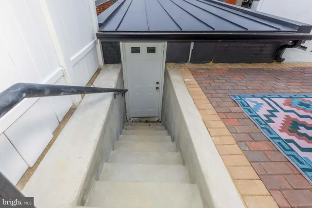 a view of a balcony with furniture