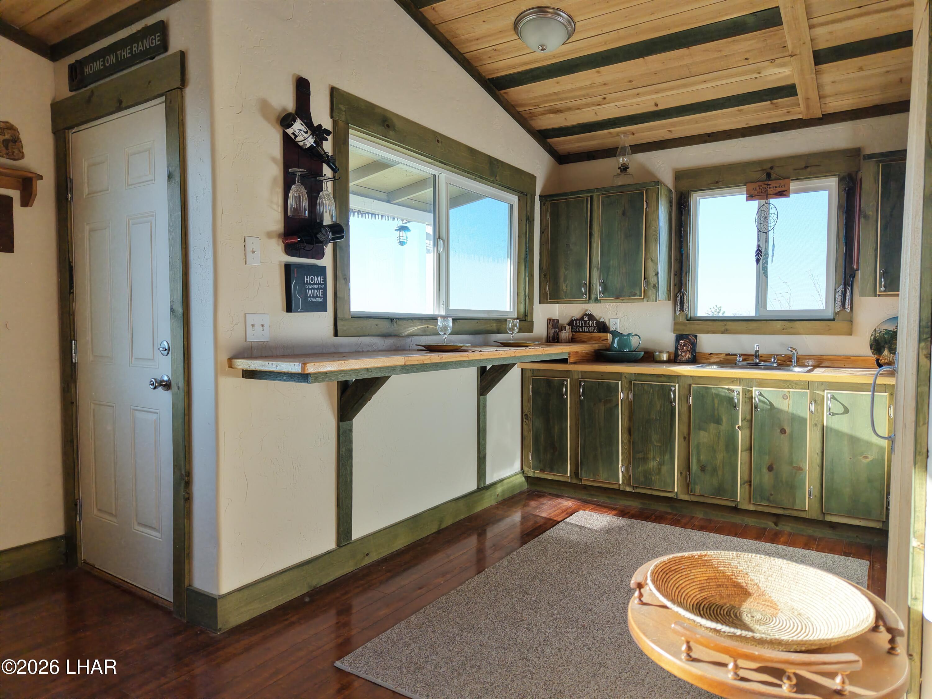 122 South Carrow Road Yucca, AZ 86438 - Photo 25 of 47 a bathroom with a sink a toilet and mirror