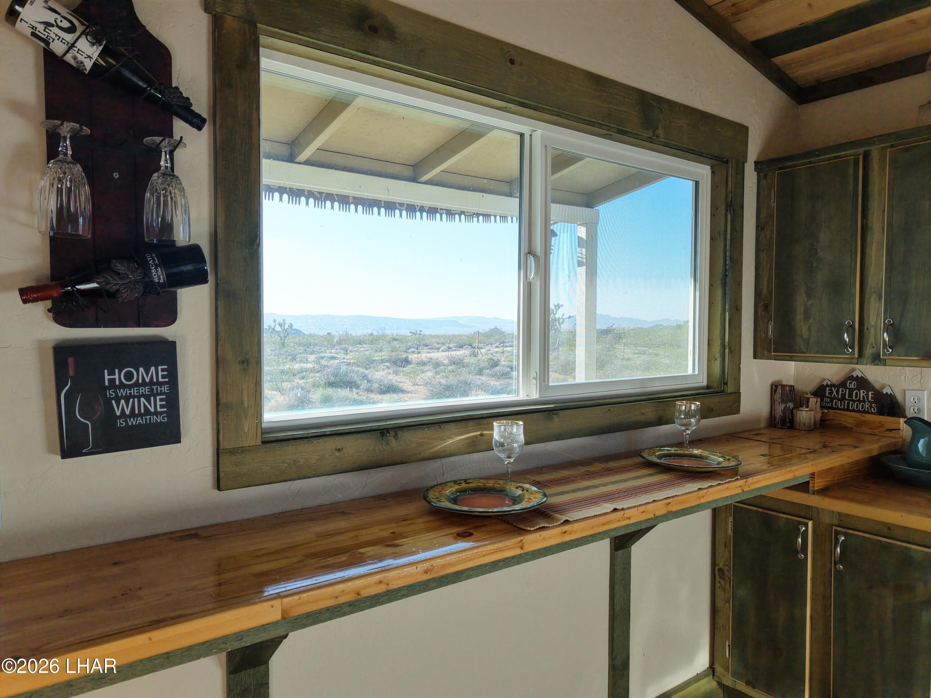 122 South Carrow Road Yucca, AZ 86438 - Photo 27 of 47 a kitchen with a sink and a window
