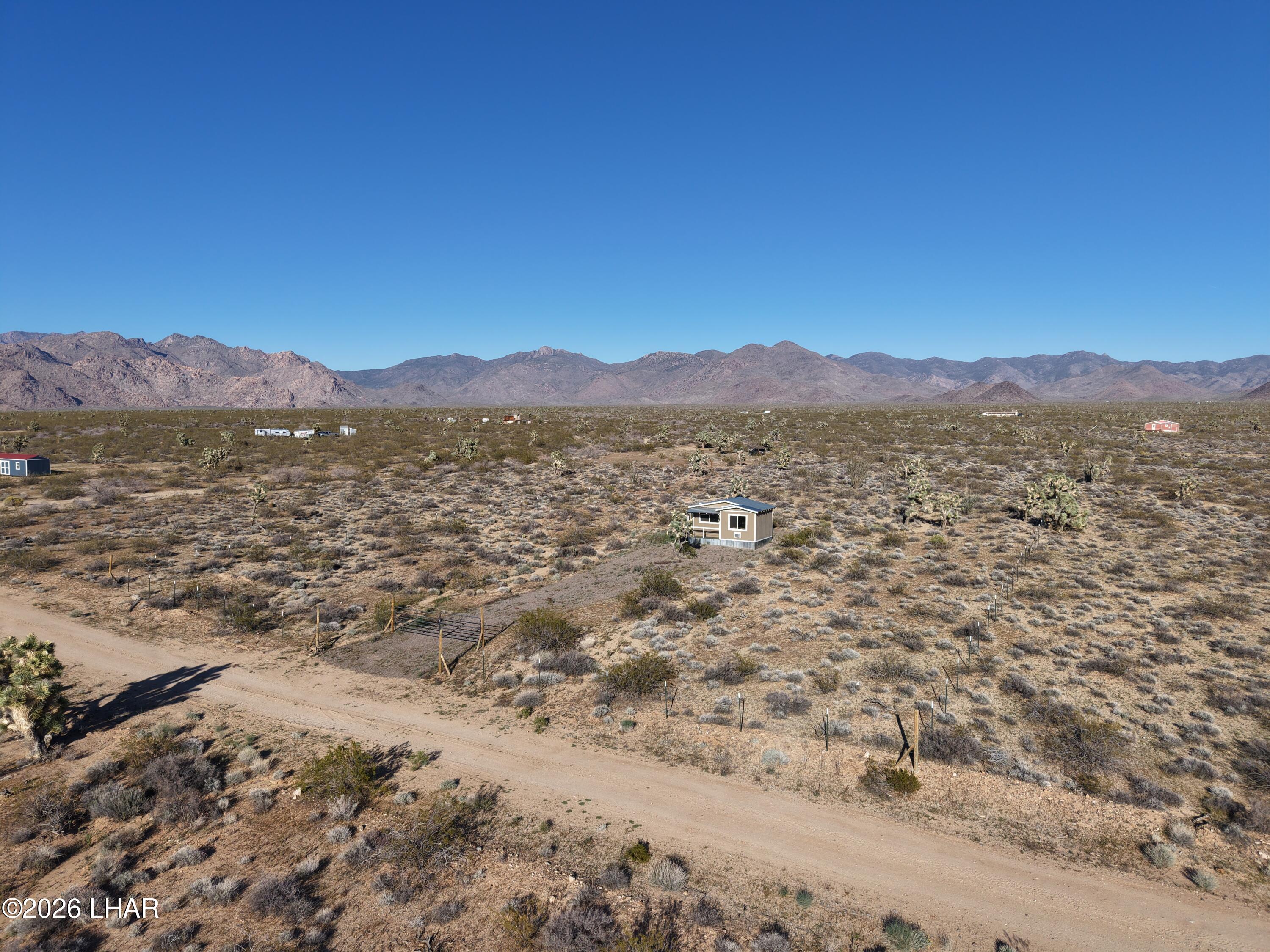 122 South Carrow Road Yucca, AZ 86438 - Photo 33 of 47 a view of an lake with a mountain in the background