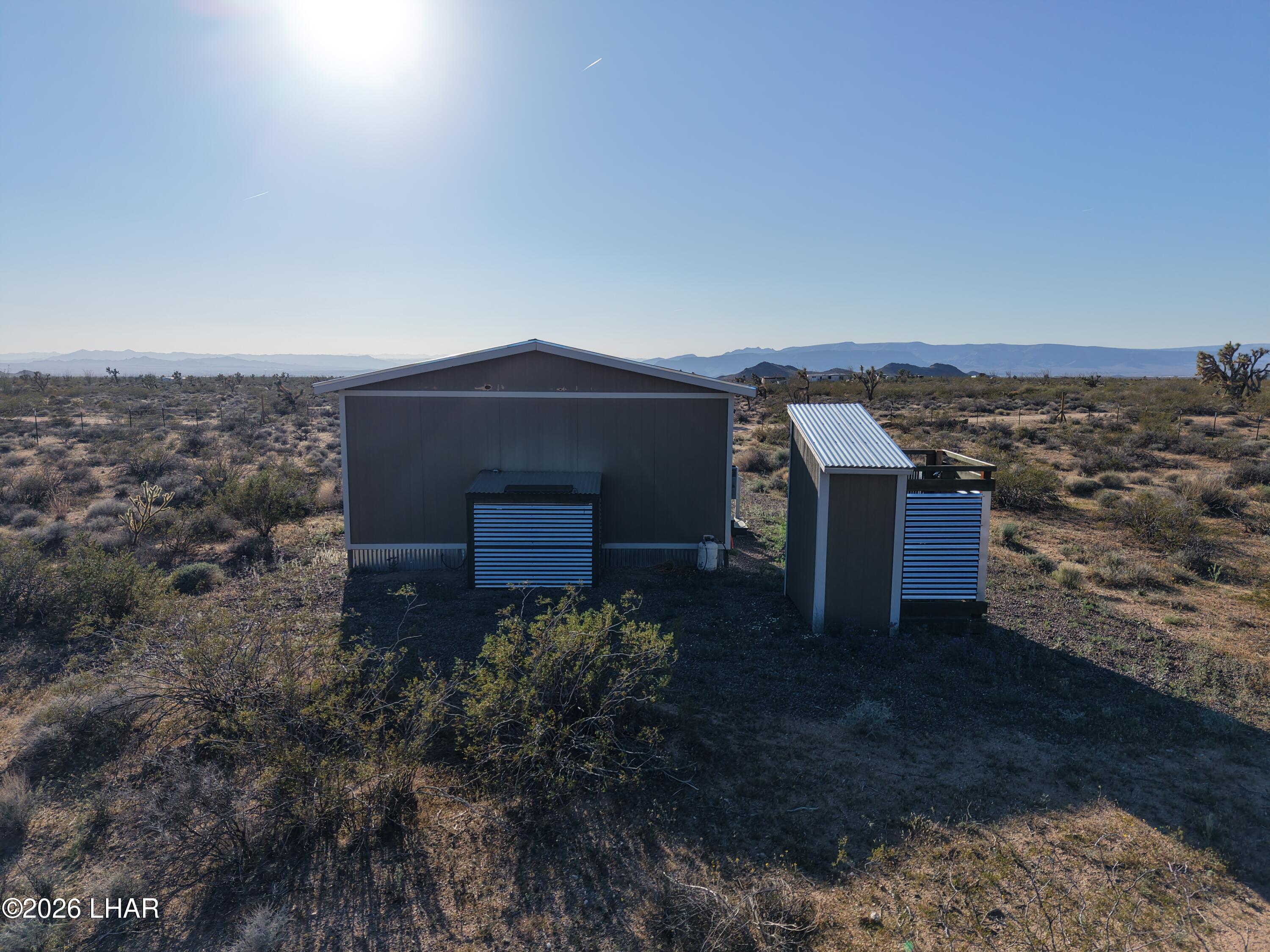 122 South Carrow Road Yucca, AZ 86438 - Photo 10 of 47 an aerial view of a house